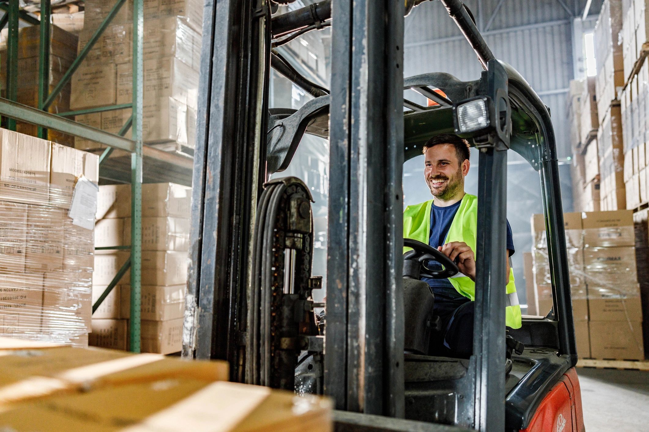 Warehouse worker driving a forklift