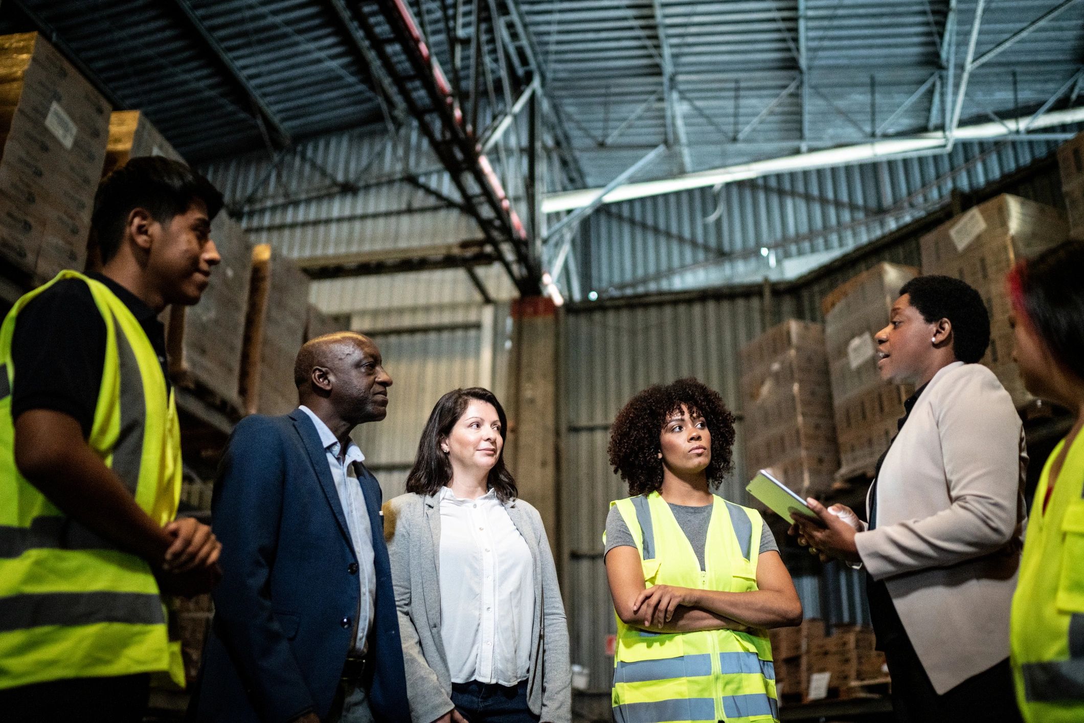 Team meeting on a warehouse floor