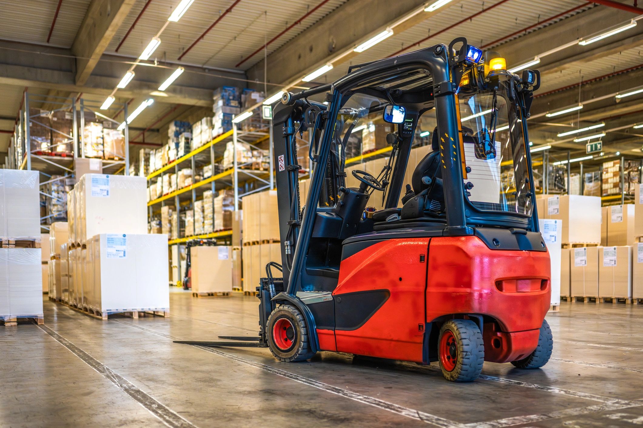 Forklift in a distribution warehouse aisle
